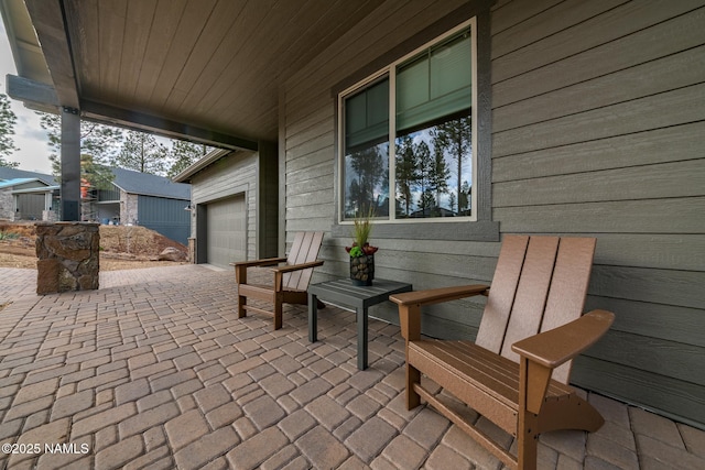 view of patio / terrace with a garage