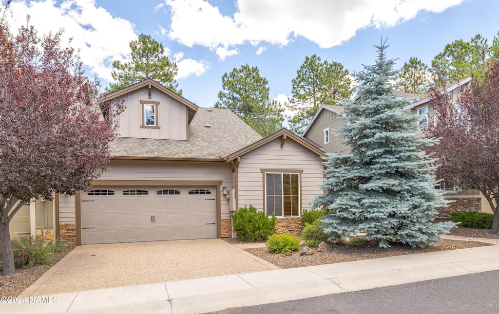 craftsman house with a garage