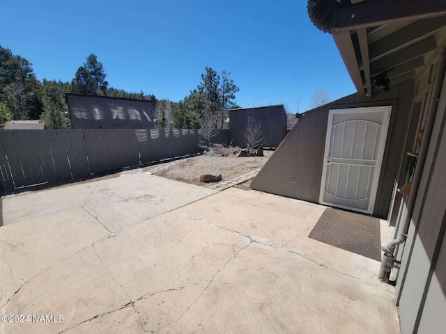 view of patio / terrace featuring a shed