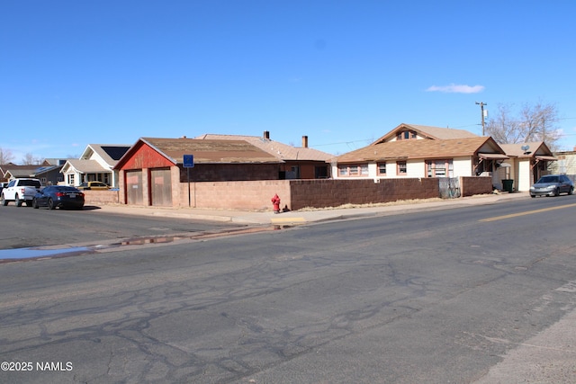 single story home with a fenced front yard