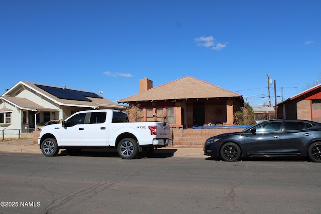 view of front of property featuring a chimney