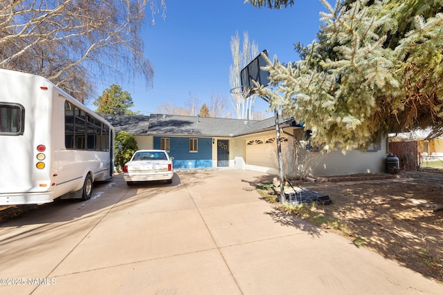 1707 N Fort Valley Rd, Flagstaff, AZ 86001 - view of front of property with a garage and concrete driveway