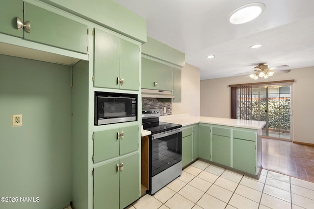 1707 N Fort Valley Rd, Flagstaff, AZ 86001 - kitchen with stainless steel range with electric stovetop, a peninsula, under cabinet range hood, backsplash, and built in microwave