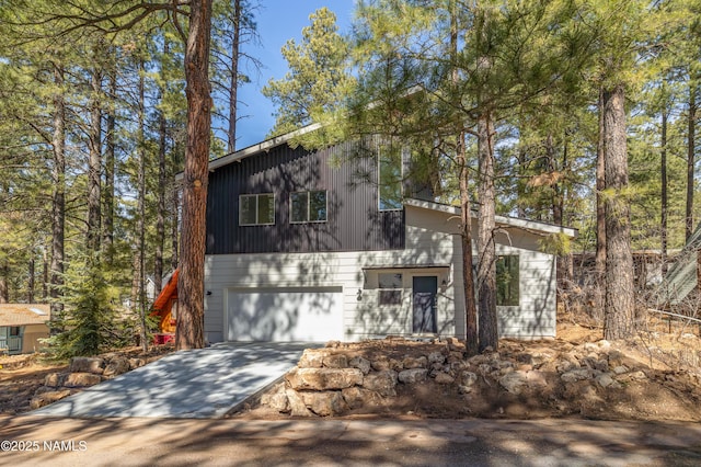 view of front of property featuring an attached garage and concrete driveway