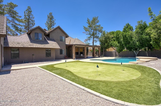 1750 E Mallory St, Mesa, AZ 85203 - view of swimming pool featuring a putting green, a patio area, and a fenced backyard