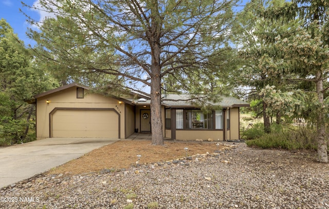 4316 E Broken Rock Loop, Flagstaff, AZ 86004 - view of front of house with driveway and a garage