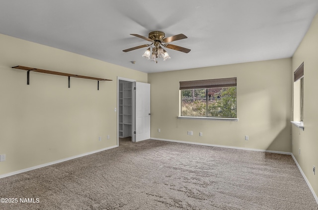 4316 E Broken Rock Loop, Flagstaff, AZ 86004 - unfurnished bedroom with carpet, baseboards, and a walk in closet