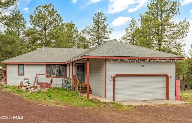 3366 Toho Trl, Flagstaff, AZ 86005 - single story home featuring dirt driveway, a shingled roof, and an attached garage