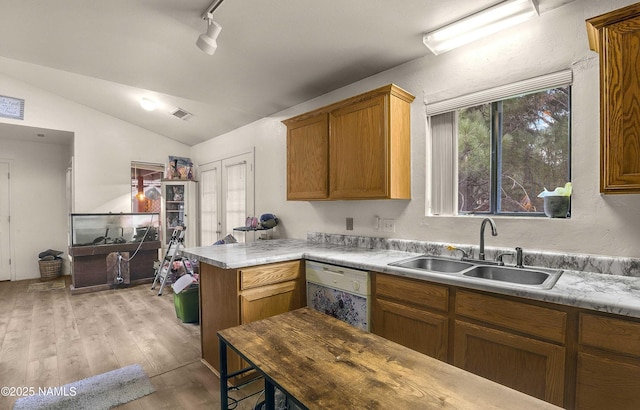 3366 Toho Trl, Flagstaff, AZ 86005 - kitchen featuring white dishwasher, light wood finished floors, visible vents, a sink, and rail lighting