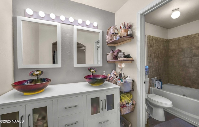3366 Toho Trl, Flagstaff, AZ 86005 - bathroom featuring toilet, washtub / shower combination, double vanity, and a sink