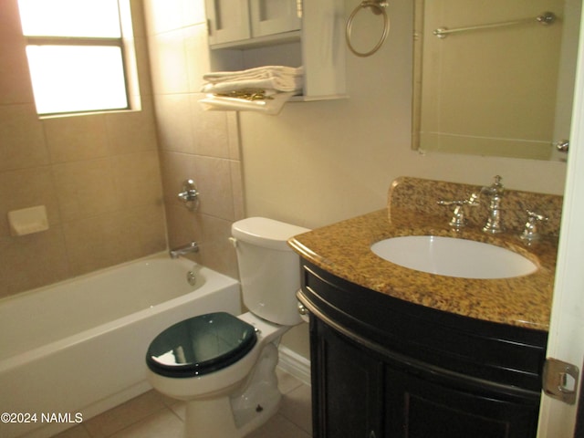 full bathroom with toilet, tiled shower / bath, tile patterned floors, and vanity