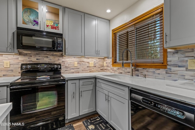 2466 N Earle Dr, Flagstaff, AZ 86004 - kitchen featuring black appliances, light countertops, decorative backsplash, and recessed lighting