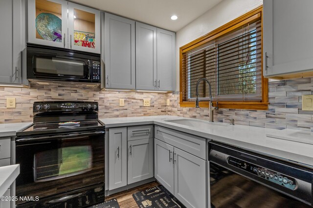2466 N Earle Dr, Flagstaff, AZ 86004 - kitchen featuring black appliances, light countertops, decorative backsplash, and recessed lighting