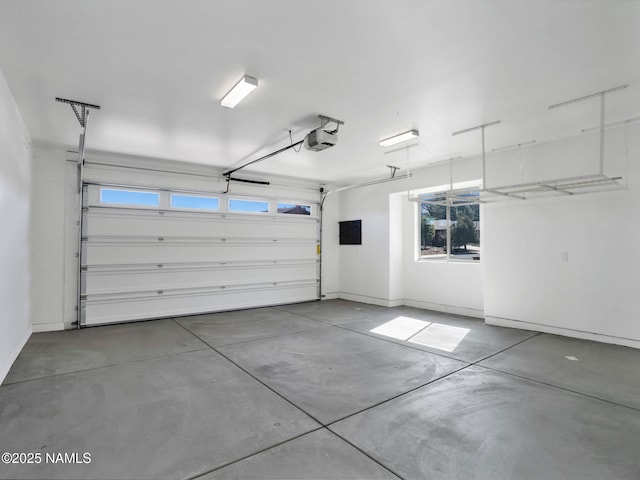 garage featuring a garage door opener and electric panel