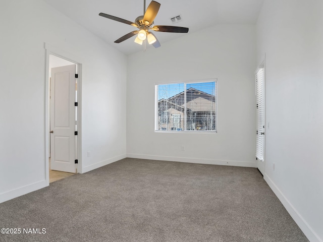 carpeted empty room featuring ceiling fan and vaulted ceiling