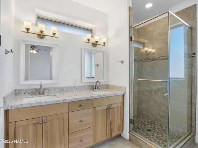 bathroom with tile patterned floors, an enclosed shower, and vanity