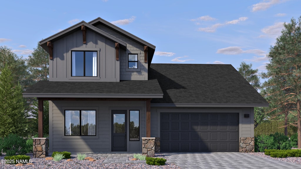 3181 W Virgo Dr Unit 13, Flagstaff, AZ 86001 - view of front of property with an attached garage, decorative driveway, roof with shingles, board and batten siding, and stone siding