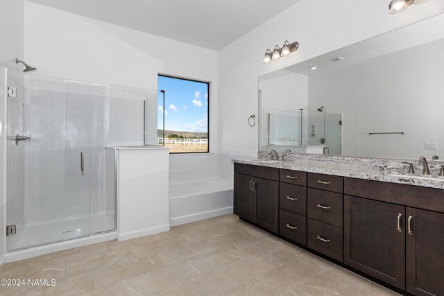 bathroom featuring independent shower and bath and vanity