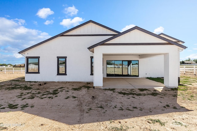 rear view of house with a patio