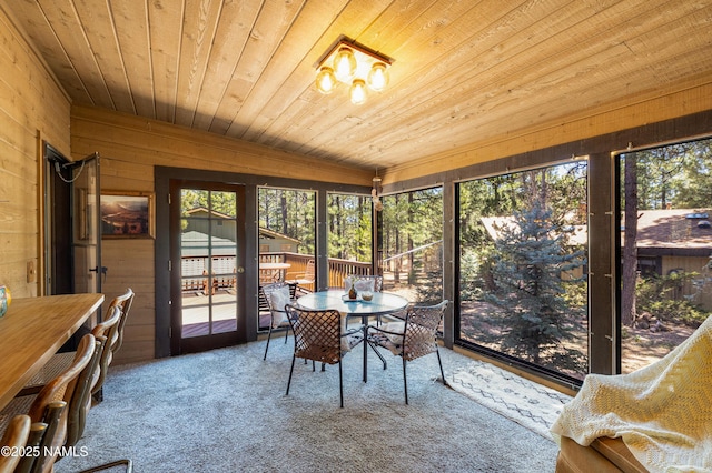 sunroom / solarium with outdoor dining area