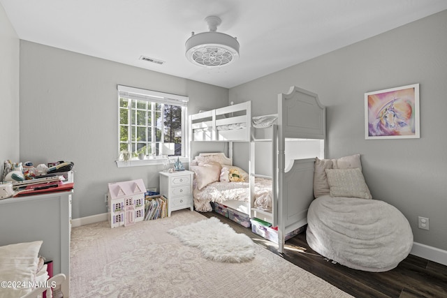 bedroom featuring dark hardwood / wood-style flooring