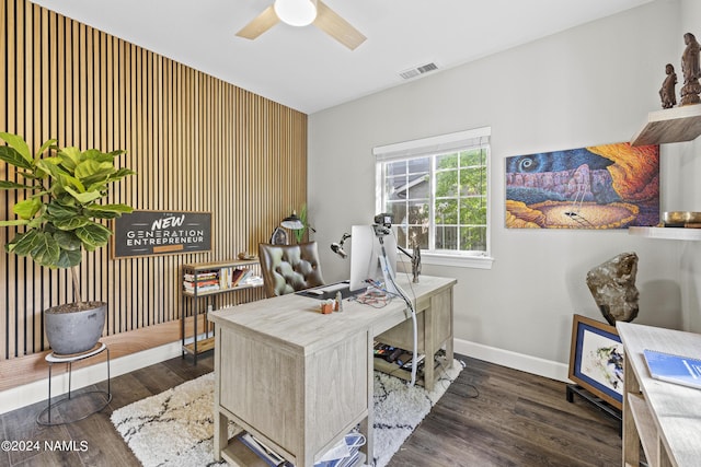 home office with dark wood-type flooring and ceiling fan