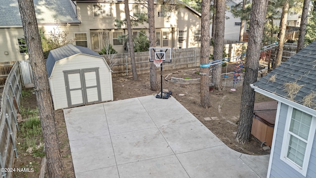 view of patio featuring a shed