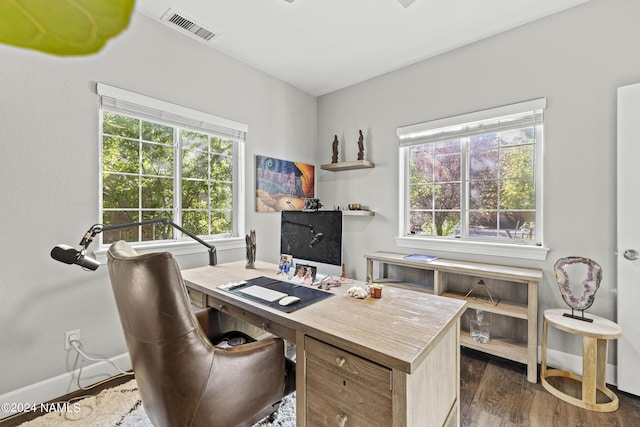 office space with dark wood-type flooring