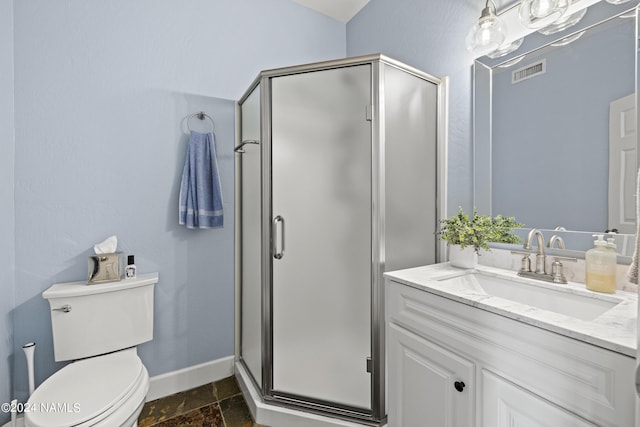 bathroom with a shower with shower door, toilet, and vanity