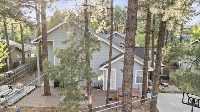 view of side of home with a patio area