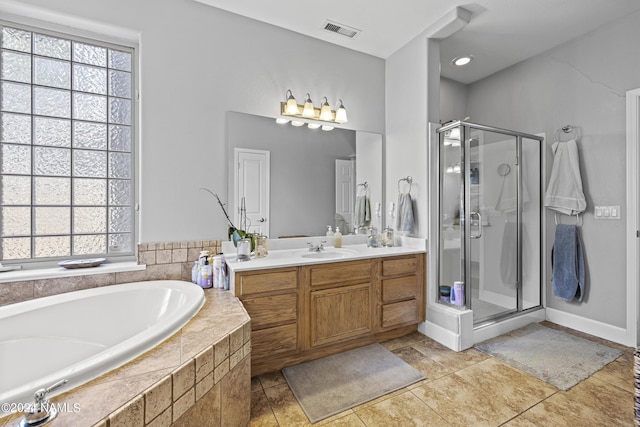 bathroom with vanity, tile patterned floors, and separate shower and tub