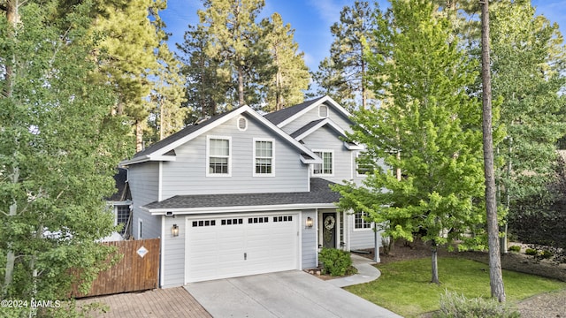 front of property featuring a garage and a front yard