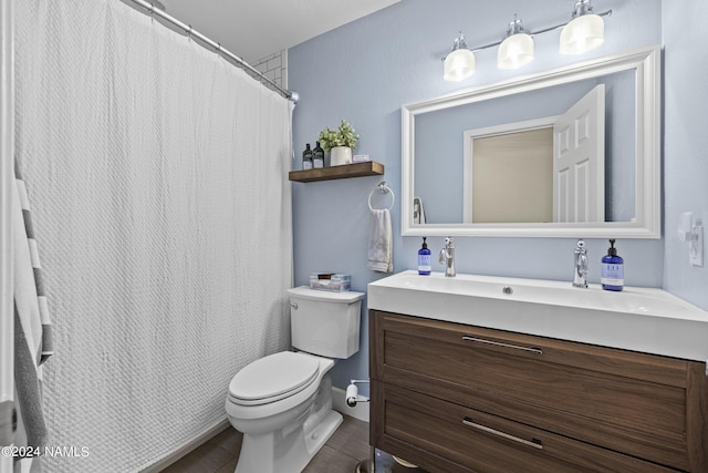 bathroom with toilet and vanity