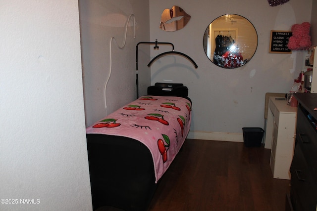 bedroom featuring dark wood-type flooring