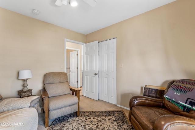 11095 N Rodeo Rd, Flagstaff, AZ 86004 - living area with ceiling fan, light carpet, and baseboards