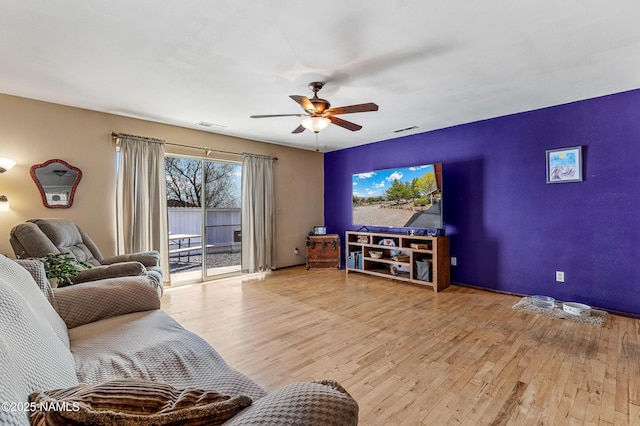 11095 N Rodeo Rd, Flagstaff, AZ 86004 - living room with visible vents, a ceiling fan, and wood finished floors