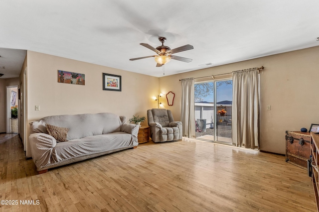 11095 N Rodeo Rd, Flagstaff, AZ 86004 - living room with visible vents, hardwood / wood-style flooring, and ceiling fan
