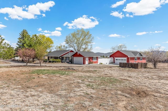 11095 N Rodeo Rd, Flagstaff, AZ 86004 - view of front of home featuring an attached garage and fence
