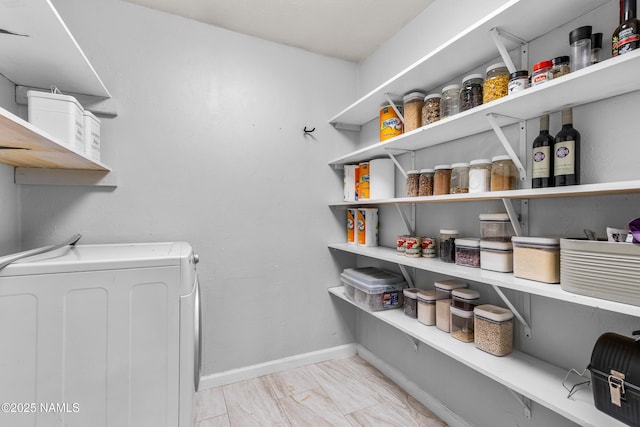 pantry featuring washer / clothes dryer