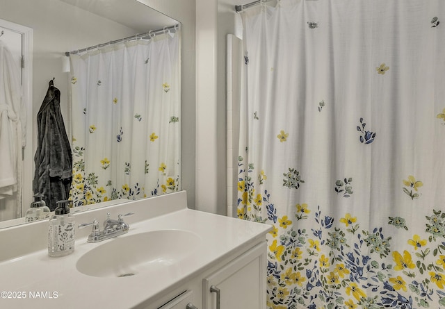 full bath with a shower with shower curtain and vanity