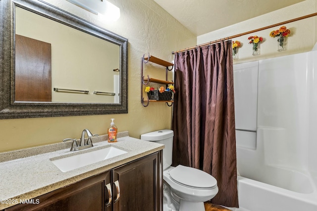 bathroom featuring shower / bath combo with shower curtain, toilet, vanity, and a textured wall