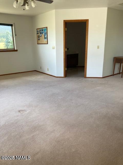 8355 N Stony Mountain Way, Flagstaff, AZ 86001 - unfurnished room with carpet, baseboards, and ceiling fan