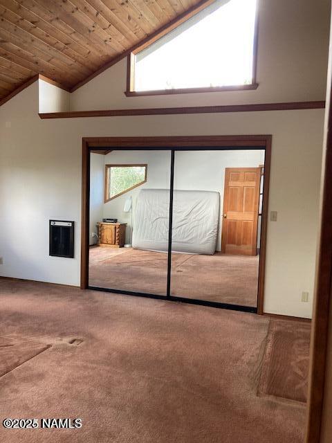 8355 N Stony Mountain Way, Flagstaff, AZ 86001 - empty room with carpet flooring, wood ceiling, heating unit, and high vaulted ceiling