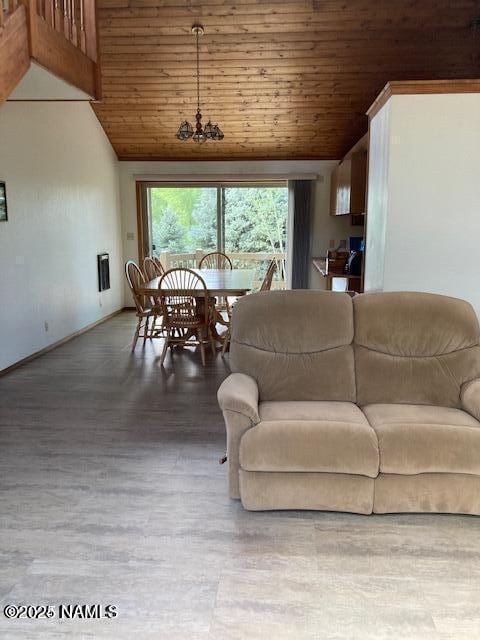 8355 N Stony Mountain Way, Flagstaff, AZ 86001 - living area featuring wooden ceiling, plenty of natural light, high vaulted ceiling, wood finished floors, and baseboards