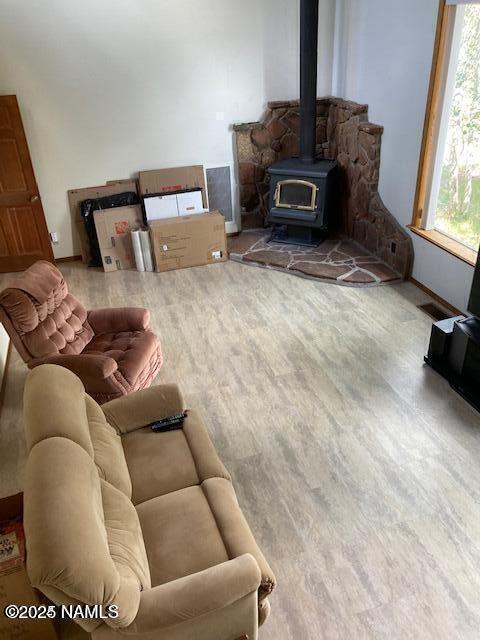 8355 N Stony Mountain Way, Flagstaff, AZ 86001 - living area with a wood stove and wood finished floors