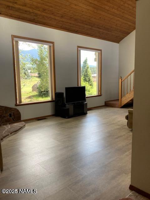 8355 N Stony Mountain Way, Flagstaff, AZ 86001 - unfurnished living room featuring vaulted ceiling and wood ceiling