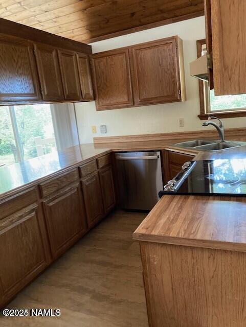 8355 N Stony Mountain Way, Flagstaff, AZ 86001 - kitchen featuring dishwasher, a sink, wood finished floors, stove, and brown cabinets