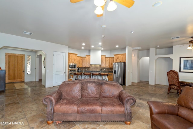 living room featuring ceiling fan