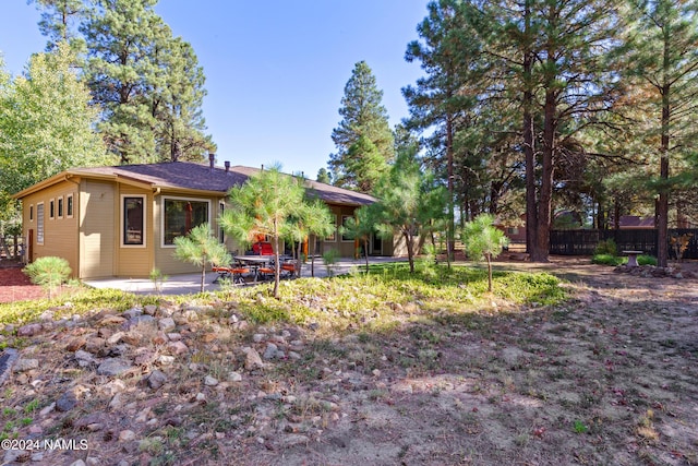 rear view of house with a patio