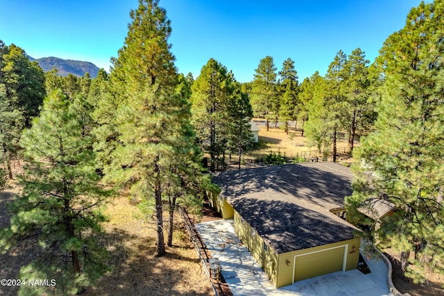 birds eye view of property with a mountain view